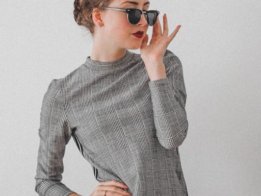 woman in black and white long sleeve dress wearing black sunglasses