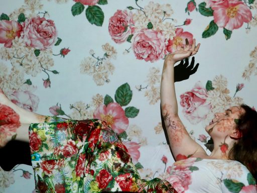 woman in red green and white floral dress