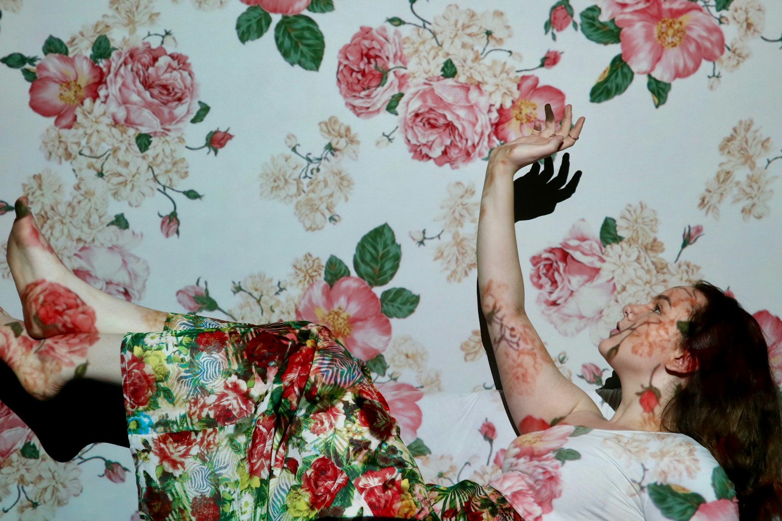 woman in red green and white floral dress