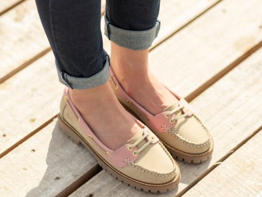 A woman standing on top of a wooden platform