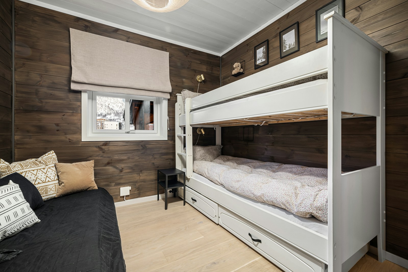 A bedroom with bunk beds and a couch