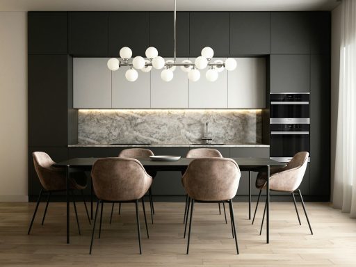 a kitchen with a table and chairs